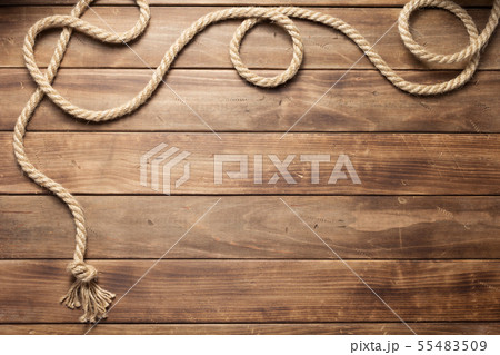 ship rope at wooden board background ship rope at wooden board background 55483509