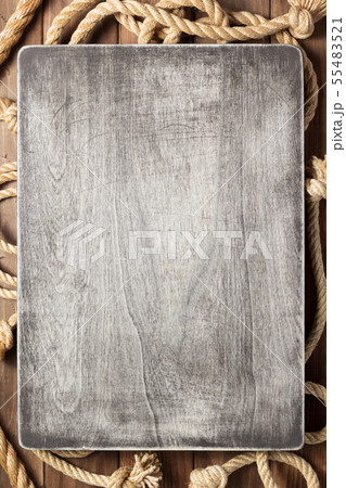 sign board and ship rope at wooden background sign board and ship rope at wooden background 55483521