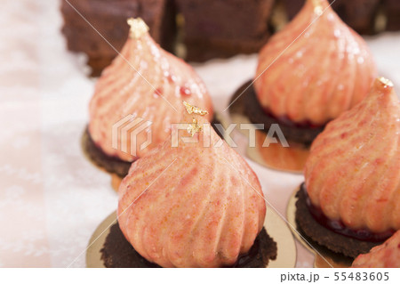 Dome-shaped mousse cake decorated with gold leaf. Dome-shaped mousse cake decorated with gold leaf. 55483605