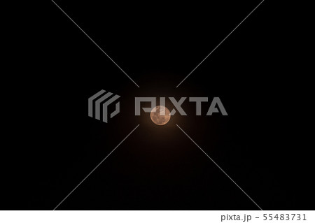 The Small full moon isolated over black background 55483731