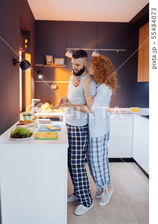 Pleasant nice caring woman hugging her husband 55484073