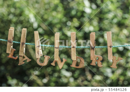 LAUNDRY word written by hanged wooden letters on LAUNDRY word written by hanged wooden letters on 55484126