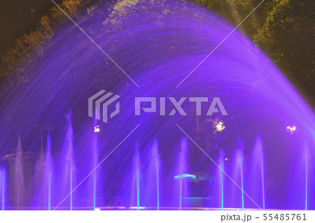 Fountain spray in blue neon illumination 55485761