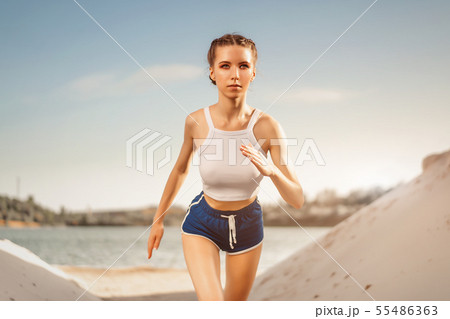 Athletic-looking young sexy girl Stock Photo by ©yacobchuk1 58228995