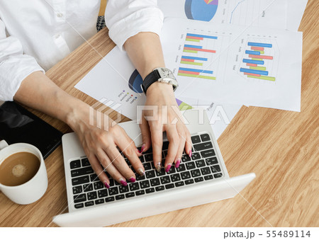 Business team work analyzing charts and graphs 55489114