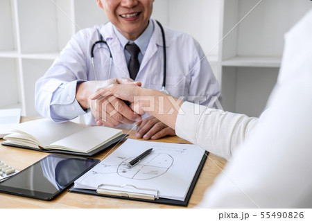 Professional Male doctor in white coat shaking Professional Male doctor in white coat shaking 55490826