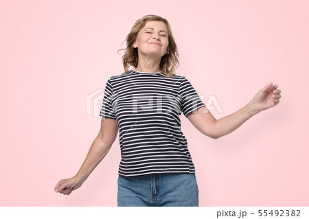 Lovely mature woman in casual clothes posing   55492382