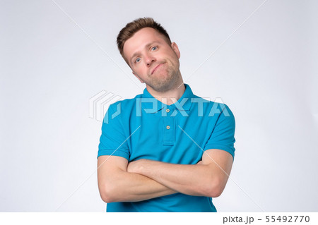 Handsome young man has serious look, listens Handsome young man has serious look, listens 55492770