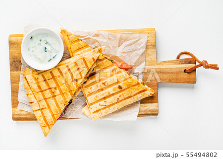 mexican quesadilla with meat, pepper and sauce 55494802