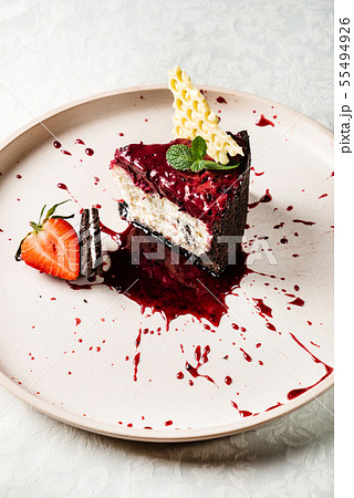 cheesecake with berry sauce 55494926