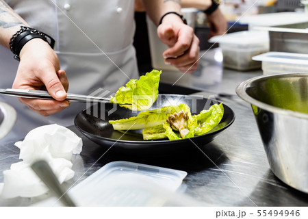 chef making salad in the restaurant chef making salad in the restaurant 55494946