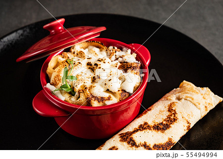 pancakes with sauce in the pot 55494994