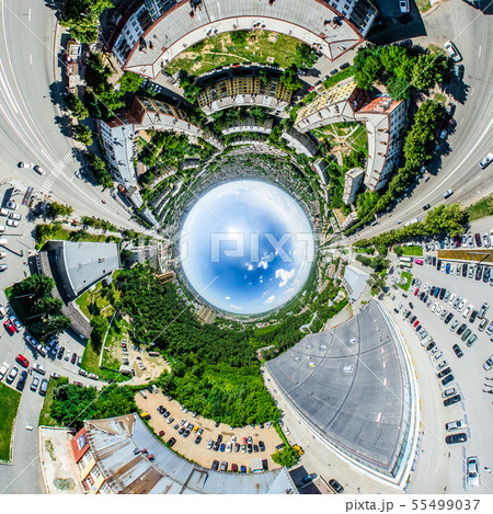 Aerial city view with crossroads and roads, houses, buildings, parks and parking lots. Sunny summer Aerial city view with crossroads and roads, houses, buildings, parks and parking lots. Sunny summer 55499037