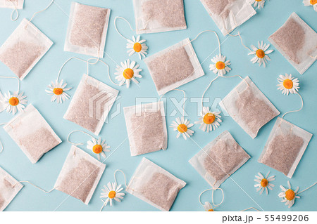 Close up of tea time. Dry camomile tea in the tea Close up of tea time. Dry camomile tea in the tea 55499206