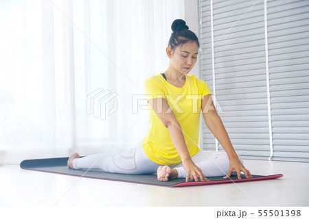 Skinny asian woman wear yellow sport t-shirt Skinny asian woman wear yellow sport t-shirt 55501398