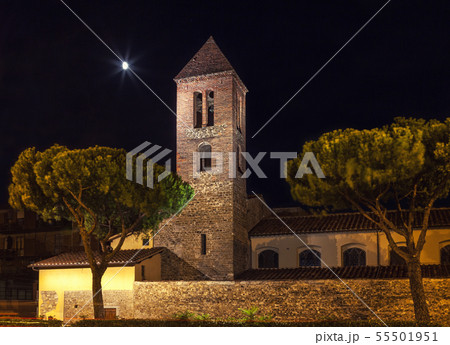 Stone fortress with a bell tower at night. Stone fortress with a bell tower at night. 55501951