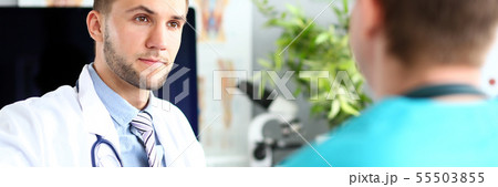 Doctor talking with colleague Doctor talking with colleague 55503855