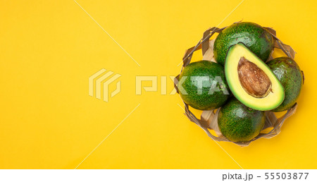 organic avocados half cut with seed and whole 55503877