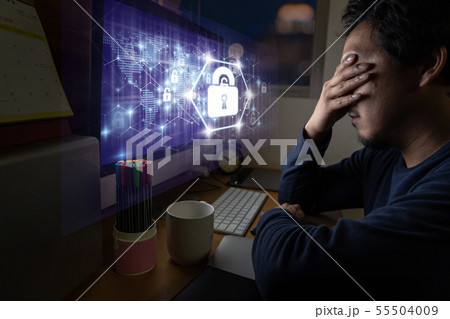 Portrait of Asia Businessman sitting and working hard via Security key lock icon digital hologram display over the world map and Hexagon shape on the computer screen in work place with serious action 55504009