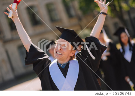 Happy boy raising his hands in the air. 55506742
