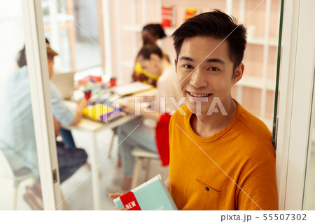 Close up of kind student that demonstrating his smile Close up of kind student that demonstrating his smile 55507302