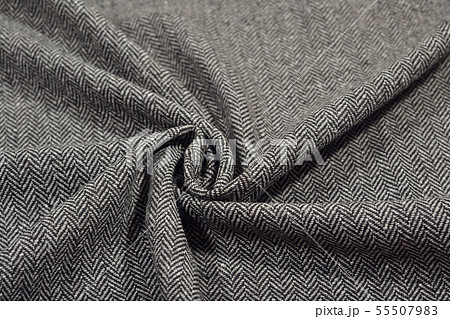 Draped herringbone tweed wool fabric texture Draped herringbone tweed wool fabric texture 55507983