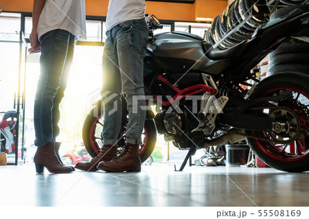 Biker couples during the preparation of travel Biker couples during the preparation of travel 55508169