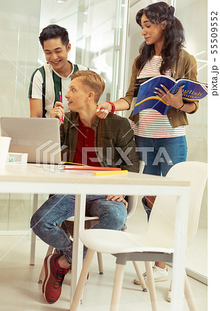 Group of friendly students discussing future exam 55509552