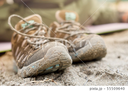 Wet shoes in the sand, blurred background 55509640
