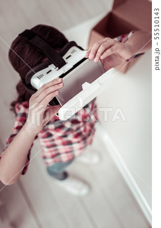 3D glasses being used by a smart young girl 55510143