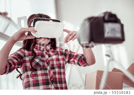 Pleasant smart girl using virtual reality glasses Pleasant smart girl using virtual reality glasses 55510181