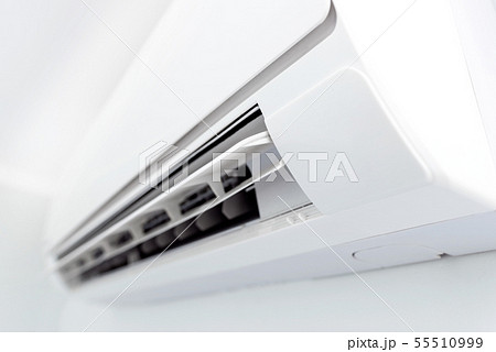 Air conditioner system on white wall room 55510999