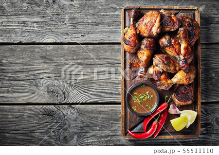 hot Grilled Jamaican Jerk Chicken, close up 55511110
