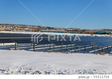 Solar panels on solar power station in snow 55511758