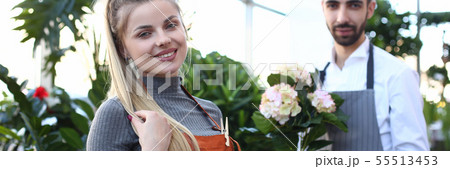 Happy Woman and Man Florist at Home Plant Shop Happy Woman and Man Florist at Home Plant Shop 55513453
