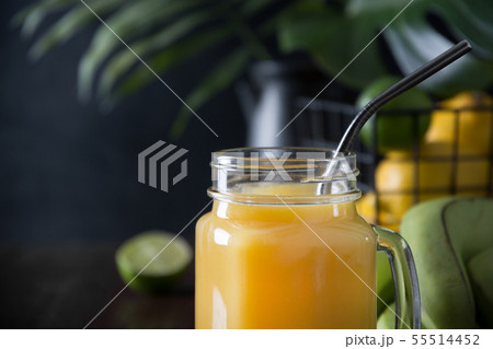 Fresh summer fruits juice with lemon, lime on dark Fresh summer fruits juice with lemon, lime on dark 55514452