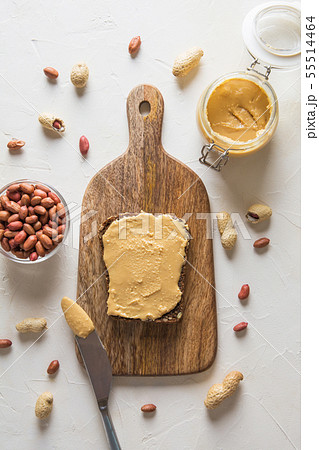 Peanut paste on brown wholegrain bread. Peanut paste on brown wholegrain bread. 55514464