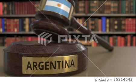 Flag of Argentina on falling judges gavel in court. National justice or jurisdiction related 55514642