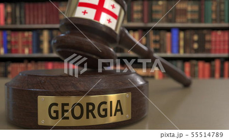 Flag of Georgia on falling judges gavel in court. National justice or jurisdiction related Flag of Georgia on falling judges gavel in court. National justice or jurisdiction related 55514789