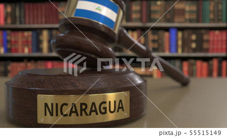 Flag of Nicaragua on falling judges gavel in court. National justice or jurisdiction related Flag of Nicaragua on falling judges gavel in court. National justice or jurisdiction related 55515149