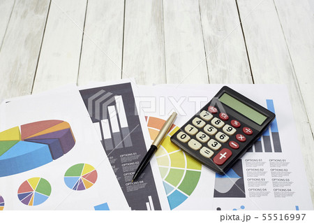 High Angle View Calculator On Documents On Table High Angle View Calculator On Documents On Table 55516997