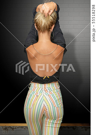 beautiful young blonde woman in pants with beautiful young blonde woman in pants with 55518298