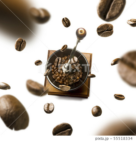 Coffee grinder and coffee beans in flight on white background Coffee grinder and coffee beans in flight on white background 55518334