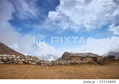A View of Amphu Gyabjen and Ama Dablan peaks with Old Stone Hut, Everest base camp trek, Nepal 55519969