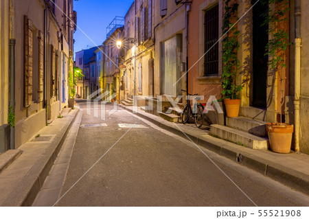 Arles. Old narrow street in the historic center of the city. 55521908