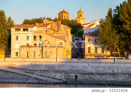 Arles. City embankment and facades of old houses at sunset. Arles. City embankment and facades of old houses at sunset. 55521926