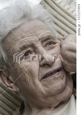 Closeup portrait of thoughtful senior woman Closeup portrait of thoughtful senior woman 55525404