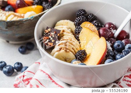 Oatmeal with banana, peach, berries and superfoods Oatmeal with banana, peach, berries and superfoods 55526190