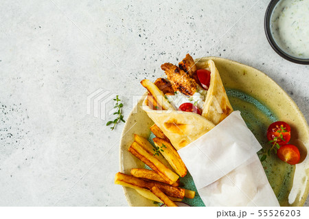Gyros souvlaki wraps in pita bread with chicken Gyros souvlaki wraps in pita bread with chicken 55526203