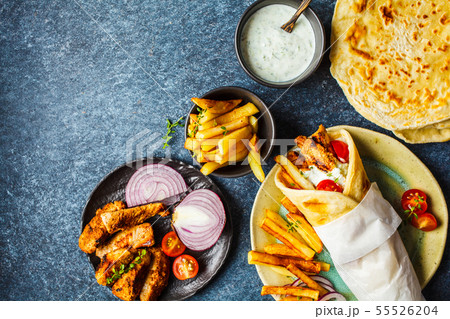 Gyros souvlaki wraps in pita bread with chicken Gyros souvlaki wraps in pita bread with chicken 55526204